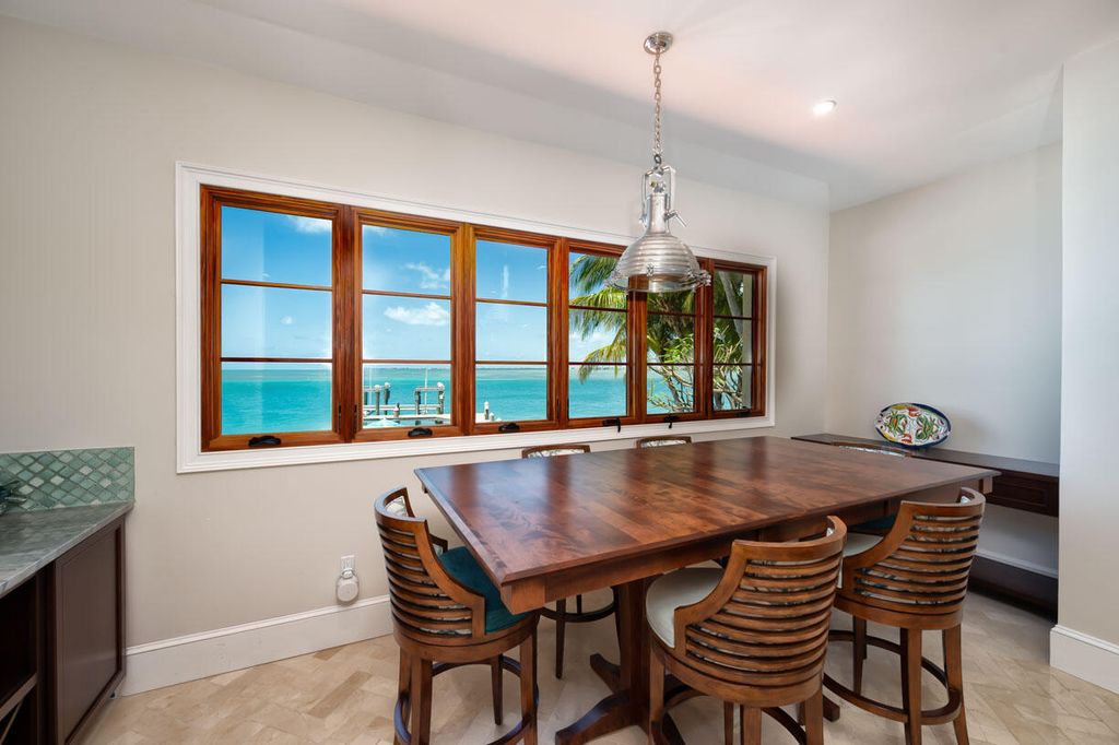 Escape to paradise in this stunning Key Colony Beach estate! Featuring an in-ground pool, private beach, and sprawling dock, this home offers unparalleled Florida Keys living. Enjoy ocean views, a chef's kitchen, and luxurious primary suite. Call today!