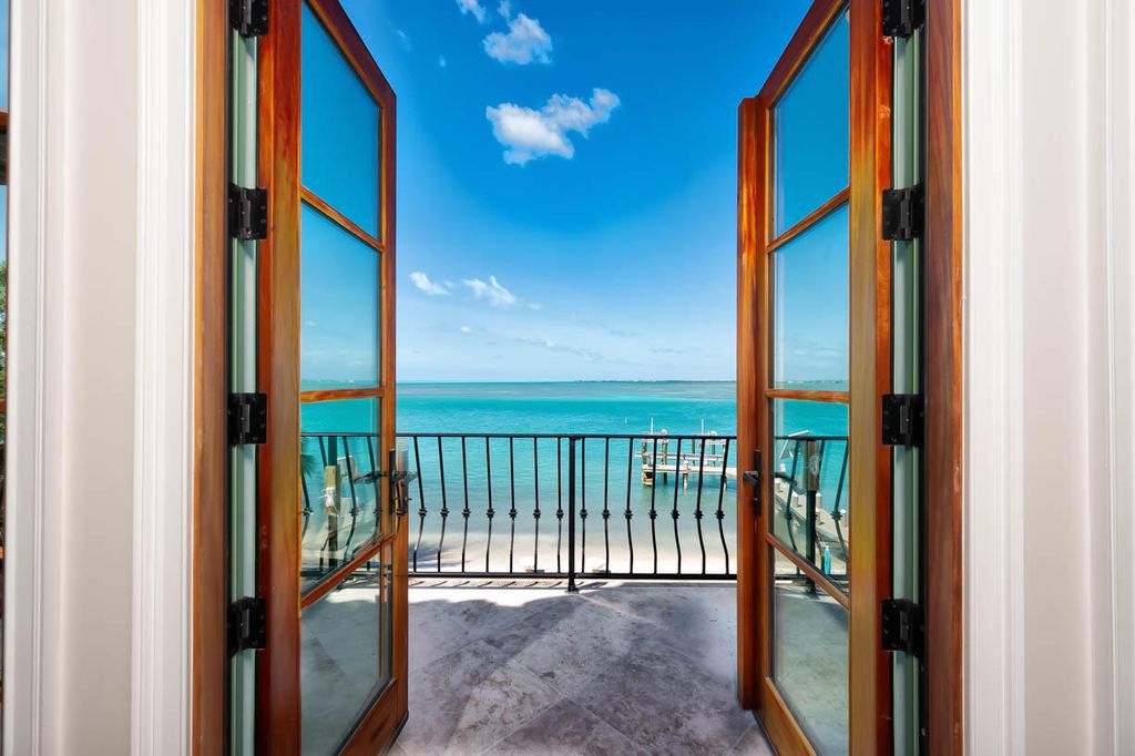 Escape to paradise in this stunning Key Colony Beach estate! Featuring an in-ground pool, private beach, and sprawling dock, this home offers unparalleled Florida Keys living. Enjoy ocean views, a chef's kitchen, and luxurious primary suite. Call today!