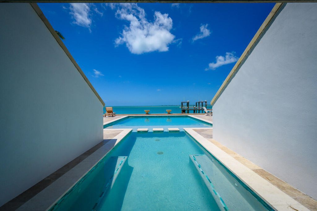 Escape to paradise in this stunning Key Colony Beach estate! Featuring an in-ground pool, private beach, and sprawling dock, this home offers unparalleled Florida Keys living. Enjoy ocean views, a chef's kitchen, and luxurious primary suite. Call today!