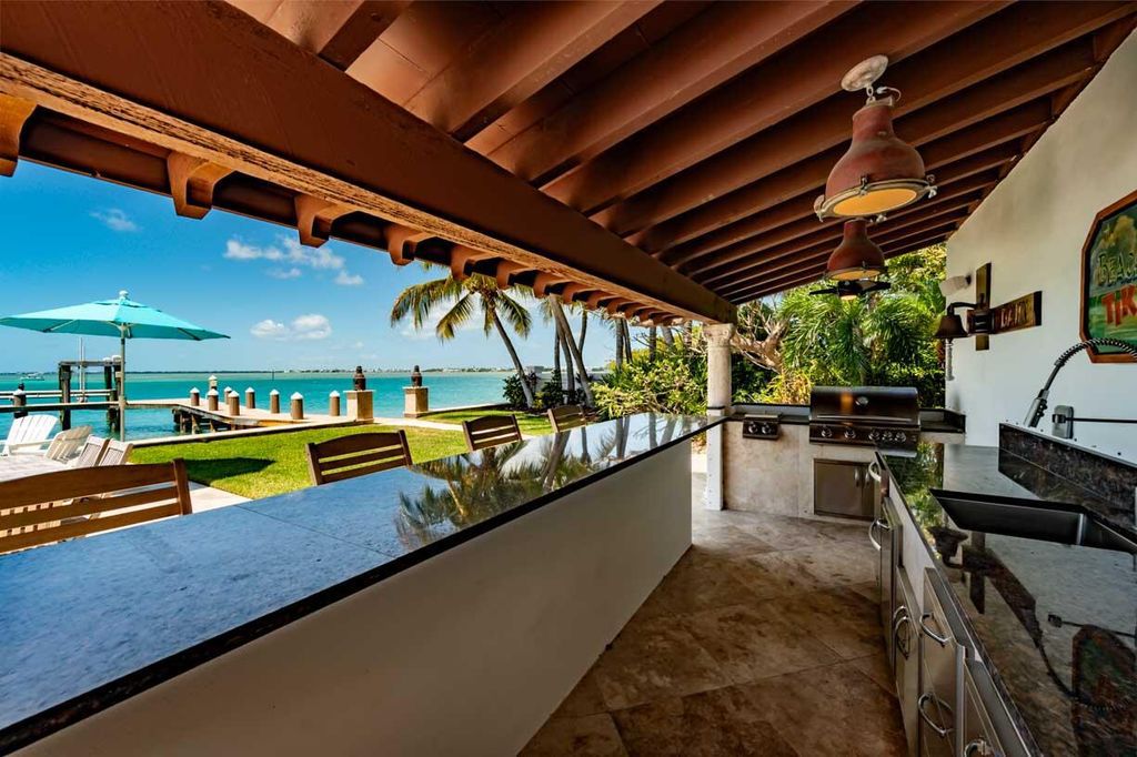 Escape to paradise in this stunning Key Colony Beach estate! Featuring an in-ground pool, private beach, and sprawling dock, this home offers unparalleled Florida Keys living. Enjoy ocean views, a chef's kitchen, and luxurious primary suite. Call today!