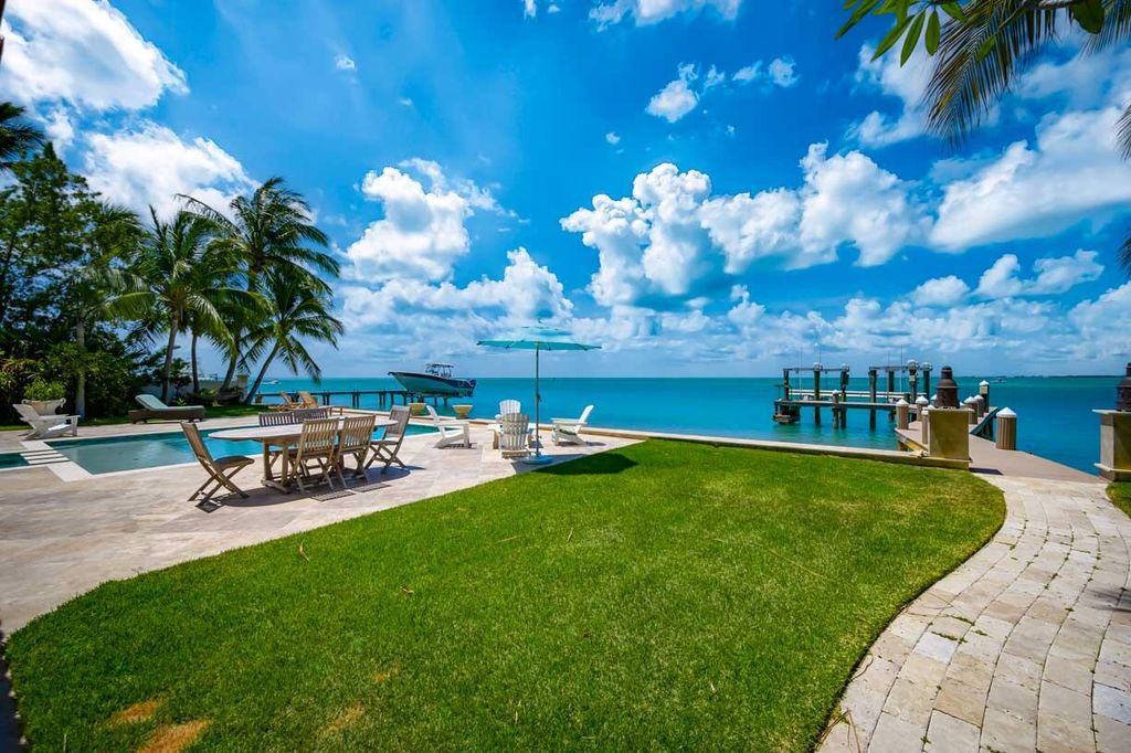 Escape to paradise in this stunning Key Colony Beach estate! Featuring an in-ground pool, private beach, and sprawling dock, this home offers unparalleled Florida Keys living. Enjoy ocean views, a chef's kitchen, and luxurious primary suite. Call today!