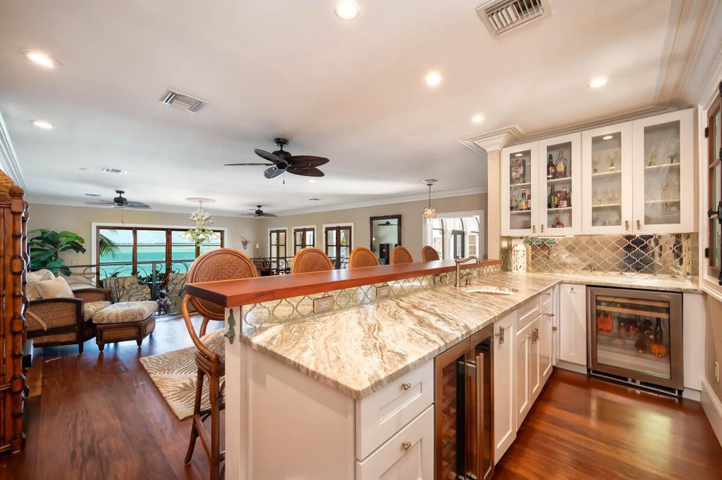 Escape to paradise in this stunning Key Colony Beach estate! Featuring an in-ground pool, private beach, and sprawling dock, this home offers unparalleled Florida Keys living. Enjoy ocean views, a chef's kitchen, and luxurious primary suite. Call today!