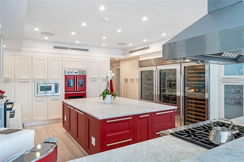 This fully renovated 7-bed, 5.5-bath masterpiece boasts stunning sunset views, a modern floor plan ideal for entertaining, and a sparkling pool with LED lighting.