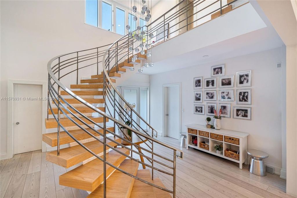 This fully renovated 7-bed, 5.5-bath masterpiece boasts stunning sunset views, a modern floor plan ideal for entertaining, and a sparkling pool with LED lighting.