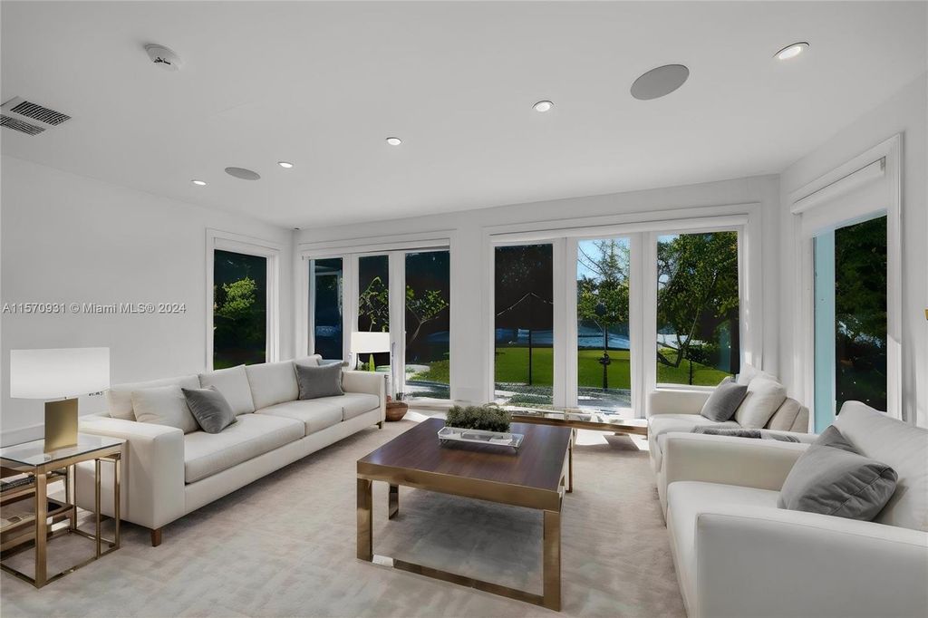 This fully renovated 7-bed, 5.5-bath masterpiece boasts stunning sunset views, a modern floor plan ideal for entertaining, and a sparkling pool with LED lighting.