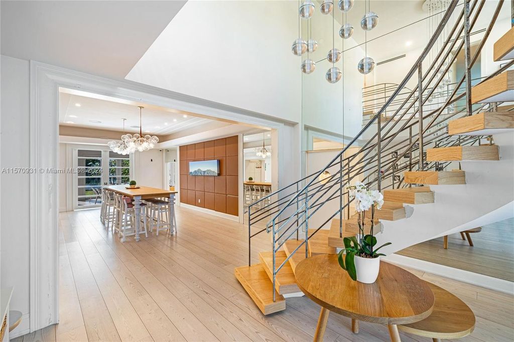 This fully renovated 7-bed, 5.5-bath masterpiece boasts stunning sunset views, a modern floor plan ideal for entertaining, and a sparkling pool with LED lighting.