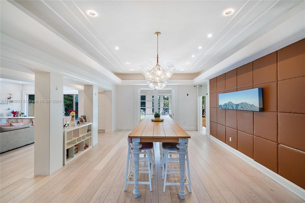 This fully renovated 7-bed, 5.5-bath masterpiece boasts stunning sunset views, a modern floor plan ideal for entertaining, and a sparkling pool with LED lighting.