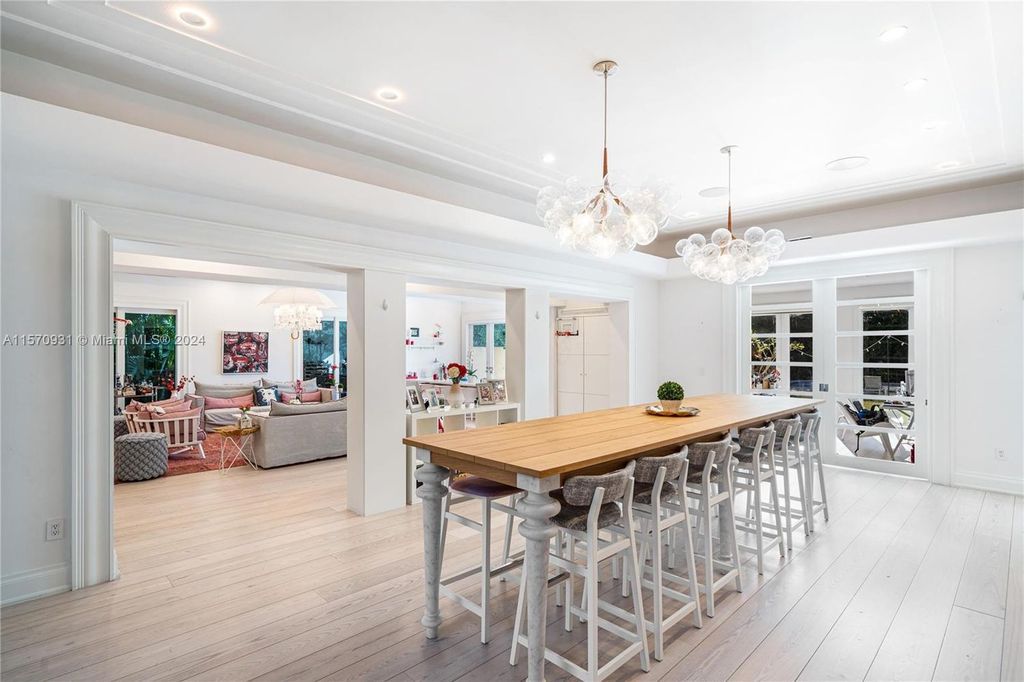 This fully renovated 7-bed, 5.5-bath masterpiece boasts stunning sunset views, a modern floor plan ideal for entertaining, and a sparkling pool with LED lighting.