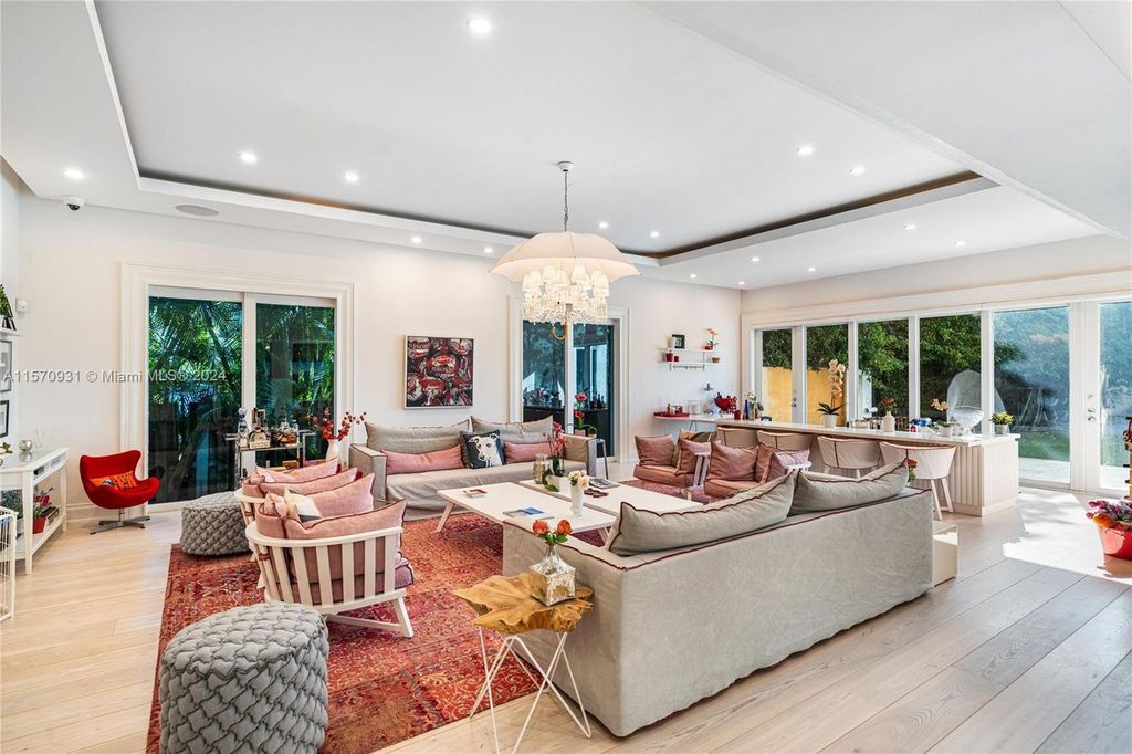 This fully renovated 7-bed, 5.5-bath masterpiece boasts stunning sunset views, a modern floor plan ideal for entertaining, and a sparkling pool with LED lighting.