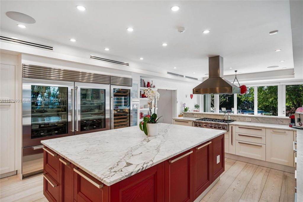 This fully renovated 7-bed, 5.5-bath masterpiece boasts stunning sunset views, a modern floor plan ideal for entertaining, and a sparkling pool with LED lighting.