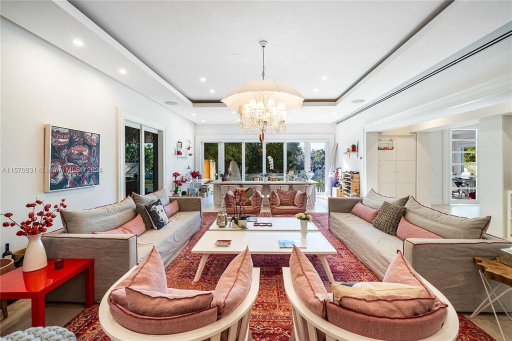 This fully renovated 7-bed, 5.5-bath masterpiece boasts stunning sunset views, a modern floor plan ideal for entertaining, and a sparkling pool with LED lighting.