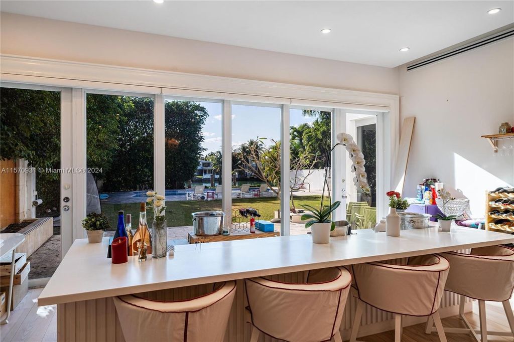 This fully renovated 7-bed, 5.5-bath masterpiece boasts stunning sunset views, a modern floor plan ideal for entertaining, and a sparkling pool with LED lighting.