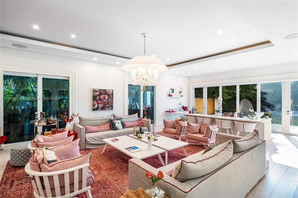 This fully renovated 7-bed, 5.5-bath masterpiece boasts stunning sunset views, a modern floor plan ideal for entertaining, and a sparkling pool with LED lighting.