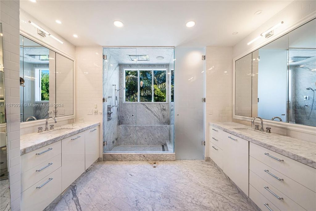 This fully renovated 7-bed, 5.5-bath masterpiece boasts stunning sunset views, a modern floor plan ideal for entertaining, and a sparkling pool with LED lighting.