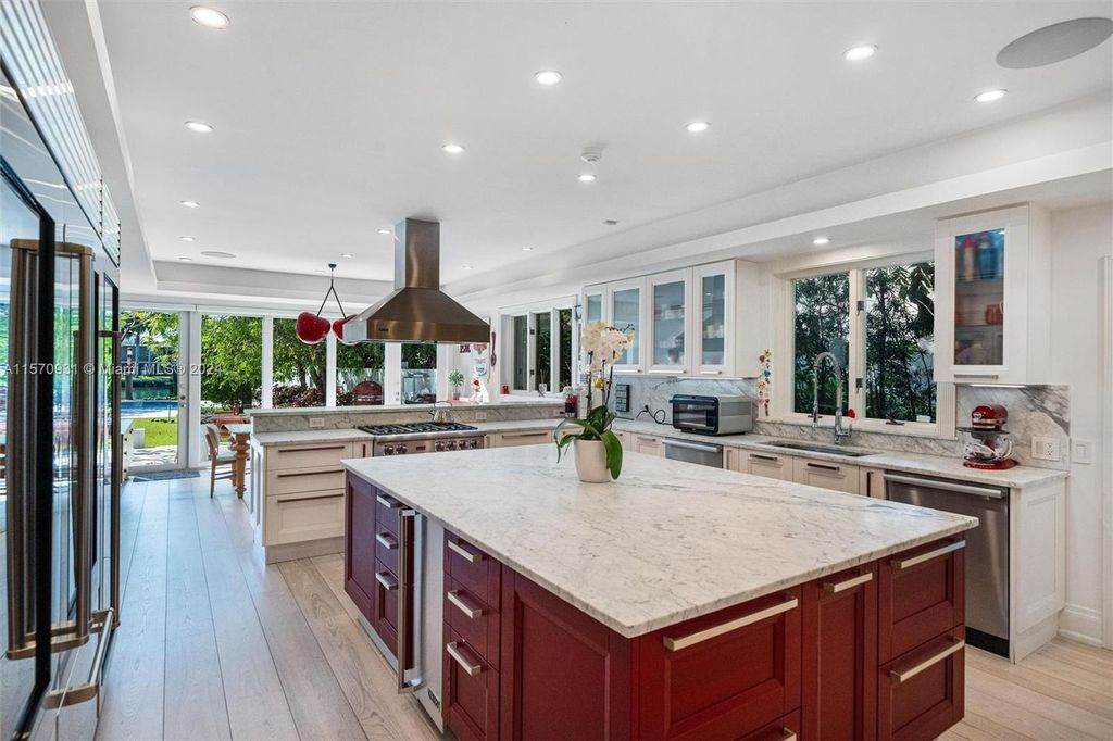 This fully renovated 7-bed, 5.5-bath masterpiece boasts stunning sunset views, a modern floor plan ideal for entertaining, and a sparkling pool with LED lighting.