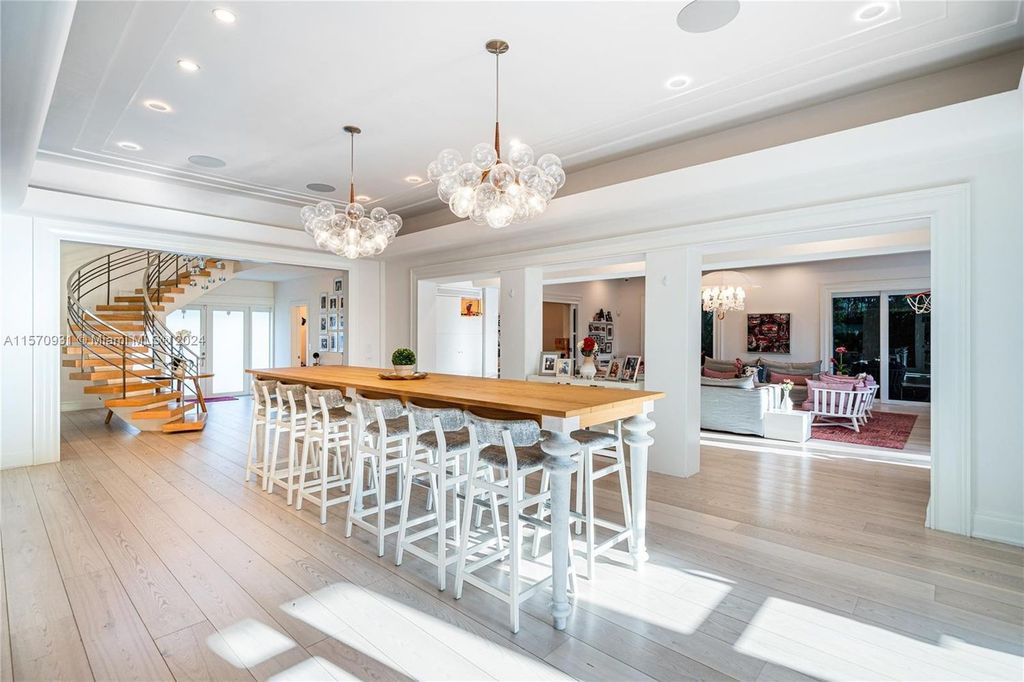 This fully renovated 7-bed, 5.5-bath masterpiece boasts stunning sunset views, a modern floor plan ideal for entertaining, and a sparkling pool with LED lighting.