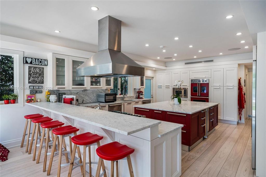 This fully renovated 7-bed, 5.5-bath masterpiece boasts stunning sunset views, a modern floor plan ideal for entertaining, and a sparkling pool with LED lighting.