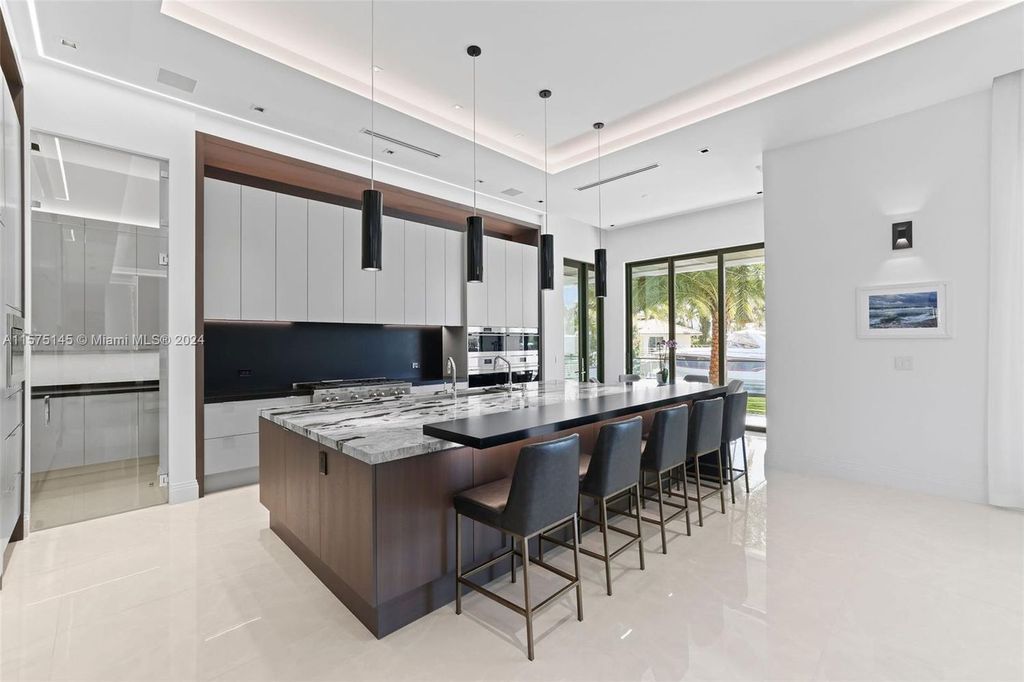 Experience luxury living at 749 Bamboo Drive. This 6 bed, 8 bath contemporary masterpiece offers 7,502 sqft of elegance, gourmet kitchen, private pool and ocean access in prestigious South Florida. Fully furnished.