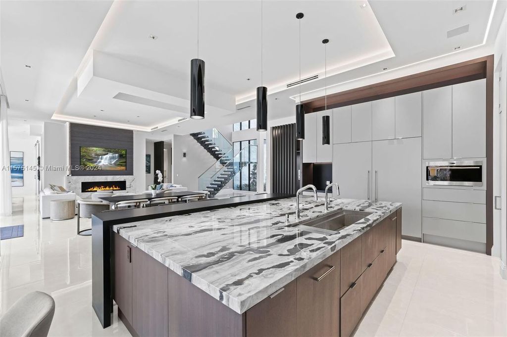 Experience luxury living at 749 Bamboo Drive. This 6 bed, 8 bath contemporary masterpiece offers 7,502 sqft of elegance, gourmet kitchen, private pool and ocean access in prestigious South Florida. Fully furnished.