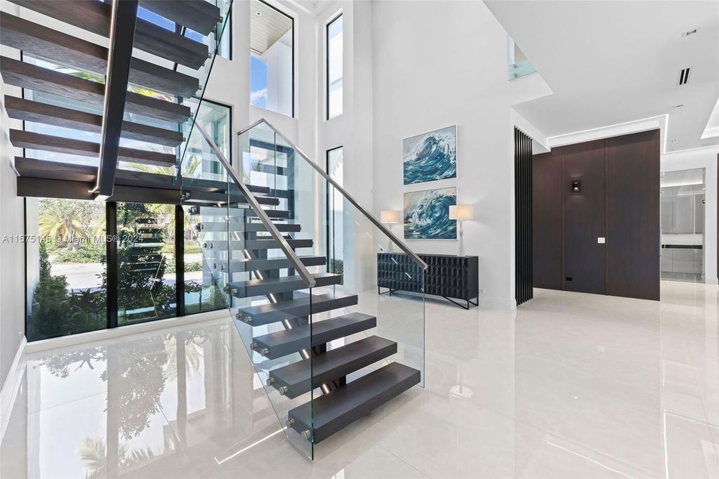 Experience luxury living at 749 Bamboo Drive. This 6 bed, 8 bath contemporary masterpiece offers 7,502 sqft of elegance, gourmet kitchen, private pool and ocean access in prestigious South Florida. Fully furnished.