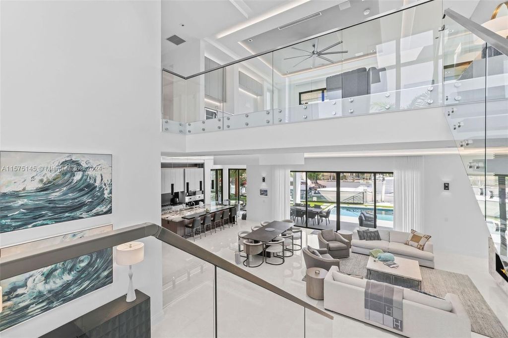 Experience luxury living at 749 Bamboo Drive. This 6 bed, 8 bath contemporary masterpiece offers 7,502 sqft of elegance, gourmet kitchen, private pool and ocean access in prestigious South Florida. Fully furnished.