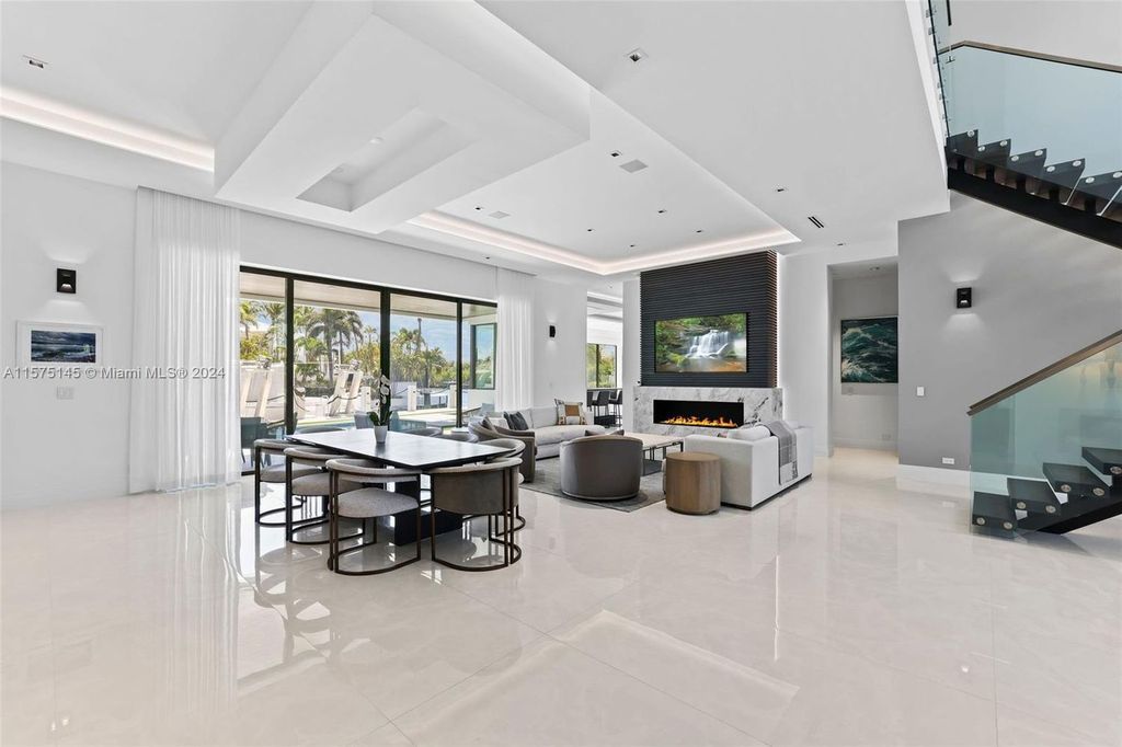 Experience luxury living at 749 Bamboo Drive. This 6 bed, 8 bath contemporary masterpiece offers 7,502 sqft of elegance, gourmet kitchen, private pool and ocean access in prestigious South Florida. Fully furnished.