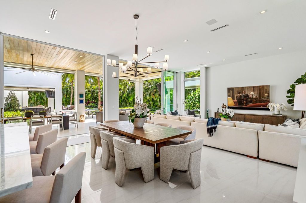 This 5-bedroom mansion in Boca Raton's Estate Section seamlessly blends indoor - outdoor living with designer finishes, resort-style pool, and lush landscaping. Designed by famed architect George Brewer, this masterpiece offers privacy and luxury in a prestigious location.