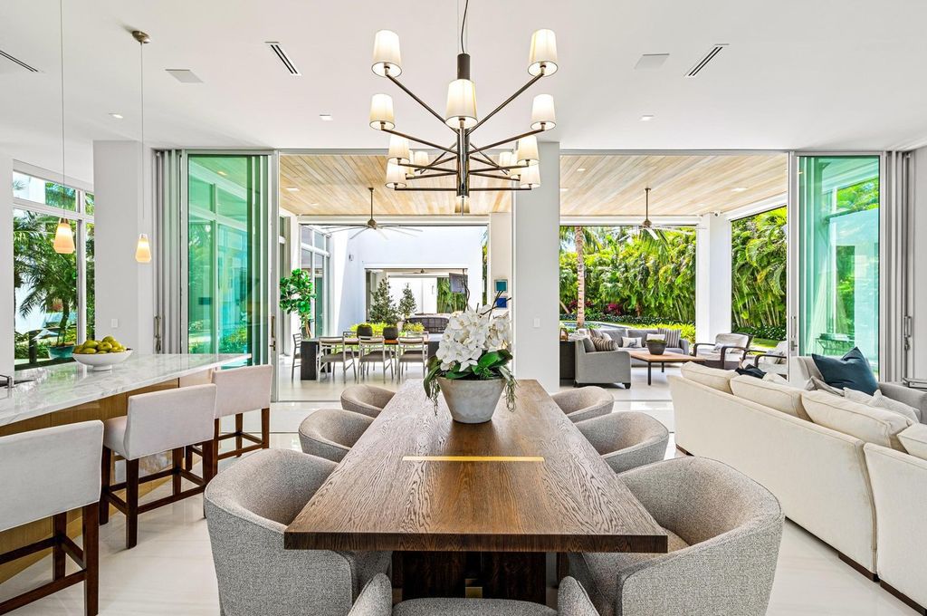 This 5-bedroom mansion in Boca Raton's Estate Section seamlessly blends indoor - outdoor living with designer finishes, resort-style pool, and lush landscaping. Designed by famed architect George Brewer, this masterpiece offers privacy and luxury in a prestigious location.