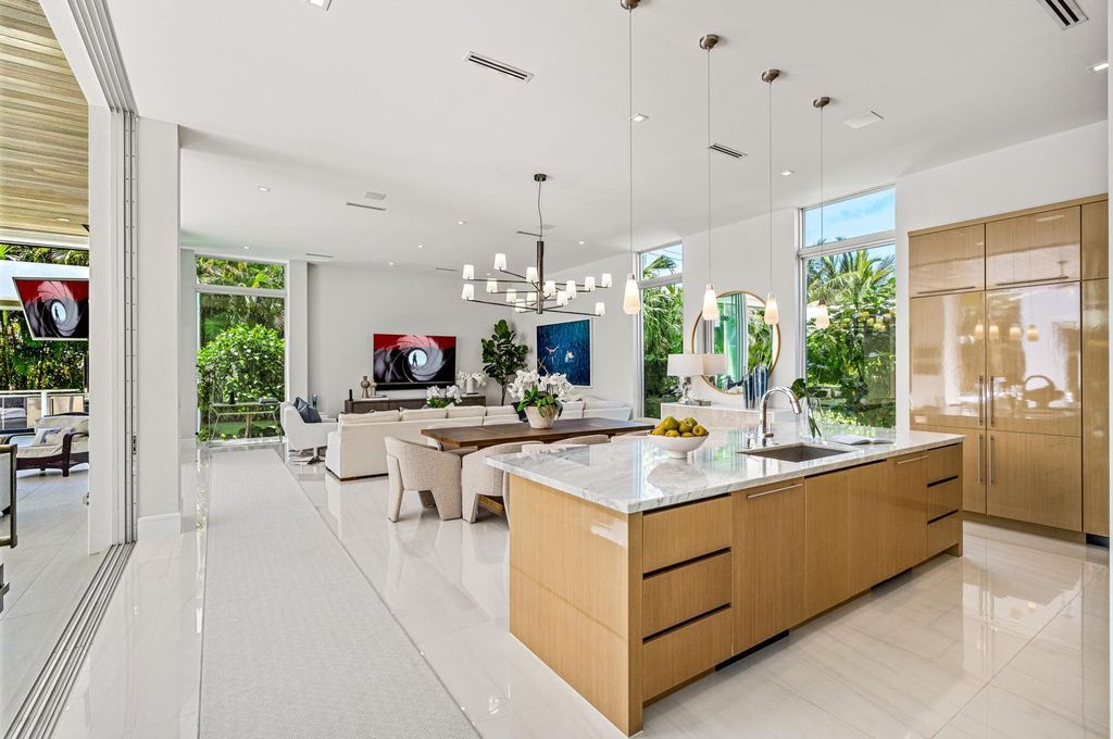 This 5-bedroom mansion in Boca Raton's Estate Section seamlessly blends indoor - outdoor living with designer finishes, resort-style pool, and lush landscaping. Designed by famed architect George Brewer, this masterpiece offers privacy and luxury in a prestigious location.