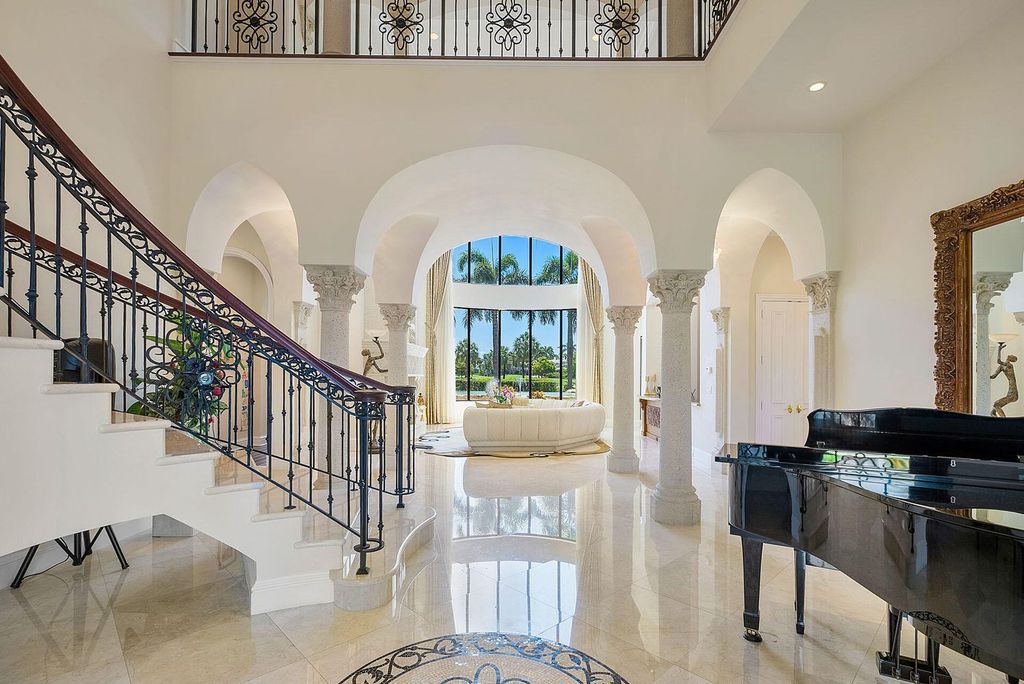 Boca Raton luxury awaits! Own a rare double-lot estate with pool, gourmet kitchen and dual master suites. Stunning golf course views in Royal Palm Yacht & Country Club.