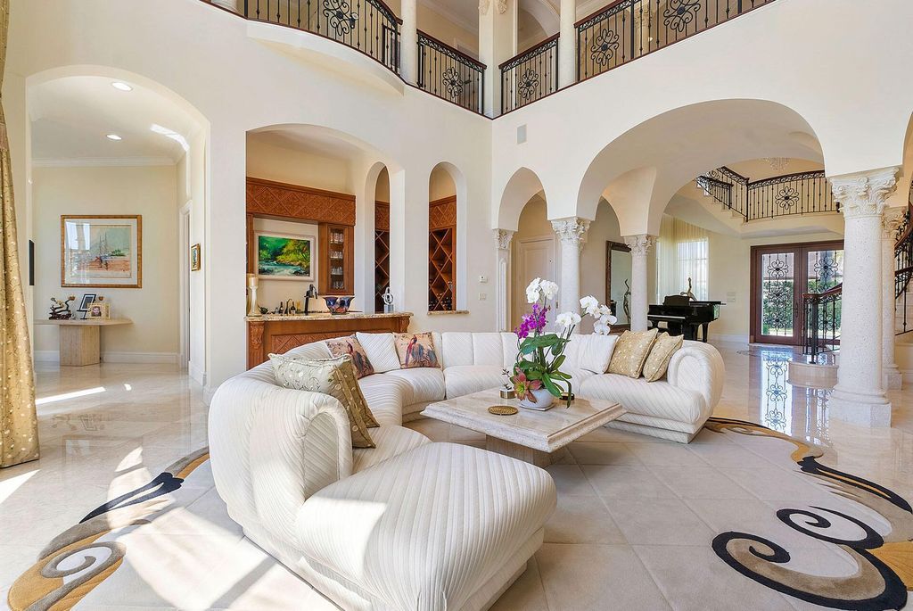 Boca Raton luxury awaits! Own a rare double-lot estate with pool, gourmet kitchen and dual master suites. Stunning golf course views in Royal Palm Yacht & Country Club.