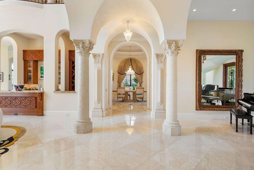 Boca Raton luxury awaits! Own a rare double-lot estate with pool, gourmet kitchen and dual master suites. Stunning golf course views in Royal Palm Yacht & Country Club.