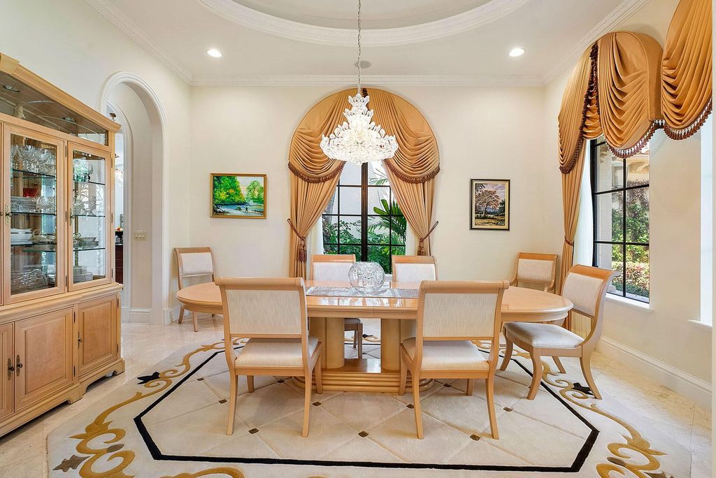 Boca Raton luxury awaits! Own a rare double-lot estate with pool, gourmet kitchen and dual master suites. Stunning golf course views in Royal Palm Yacht & Country Club.