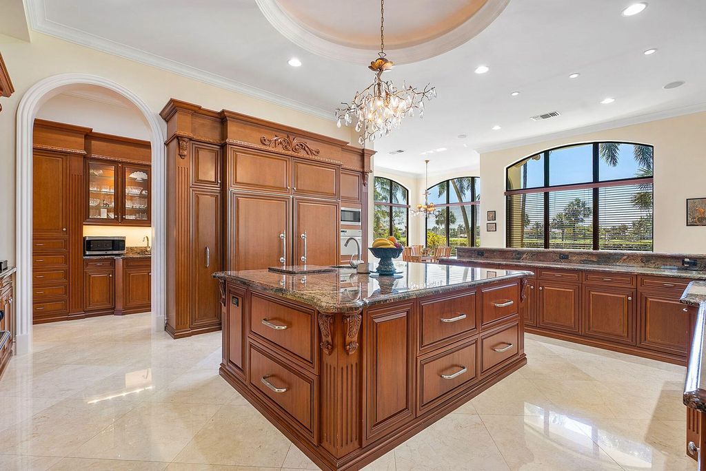 Boca Raton luxury awaits! Own a rare double-lot estate with pool, gourmet kitchen and dual master suites. Stunning golf course views in Royal Palm Yacht & Country Club.