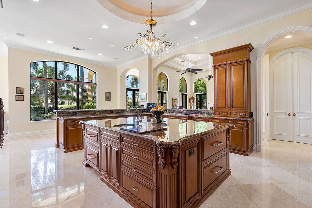 Boca Raton luxury awaits! Own a rare double-lot estate with pool, gourmet kitchen and dual master suites. Stunning golf course views in Royal Palm Yacht & Country Club.