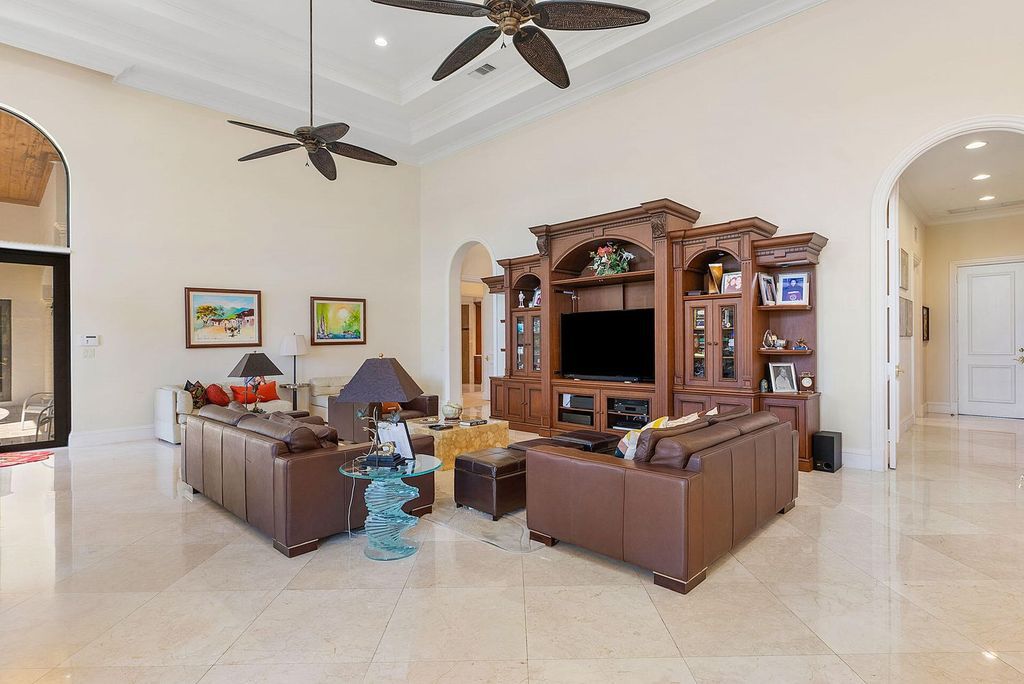 Boca Raton luxury awaits! Own a rare double-lot estate with pool, gourmet kitchen and dual master suites. Stunning golf course views in Royal Palm Yacht & Country Club.