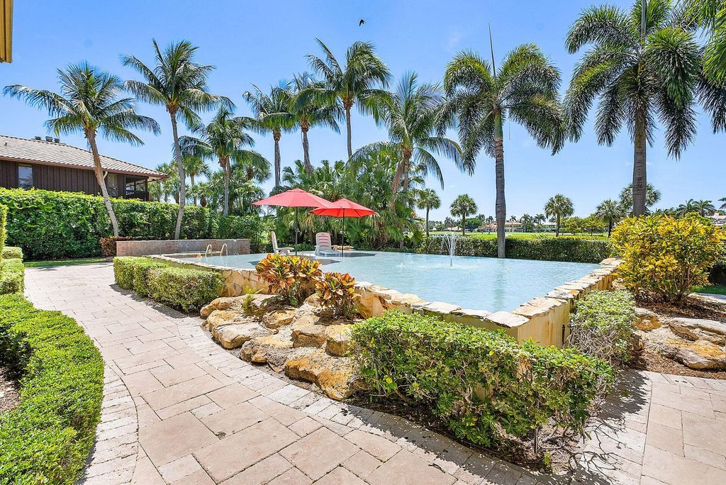 Boca Raton luxury awaits! Own a rare double-lot estate with pool, gourmet kitchen and dual master suites. Stunning golf course views in Royal Palm Yacht & Country Club.