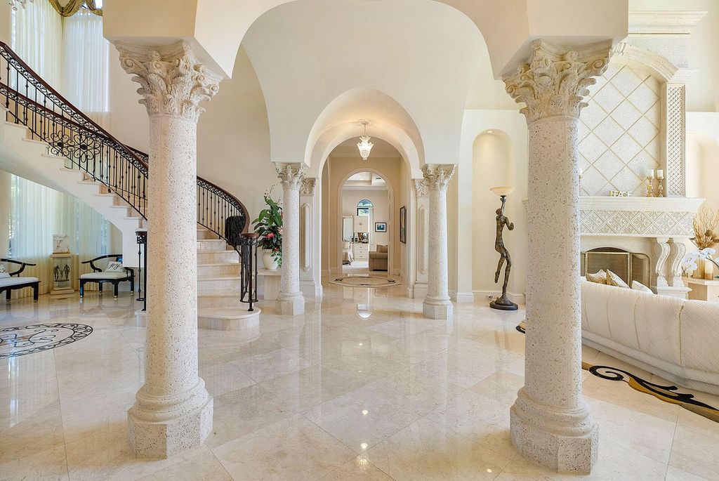 Boca Raton luxury awaits! Own a rare double-lot estate with pool, gourmet kitchen and dual master suites. Stunning golf course views in Royal Palm Yacht & Country Club.