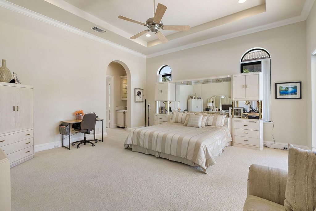 Boca Raton luxury awaits! Own a rare double-lot estate with pool, gourmet kitchen and dual master suites. Stunning golf course views in Royal Palm Yacht & Country Club.