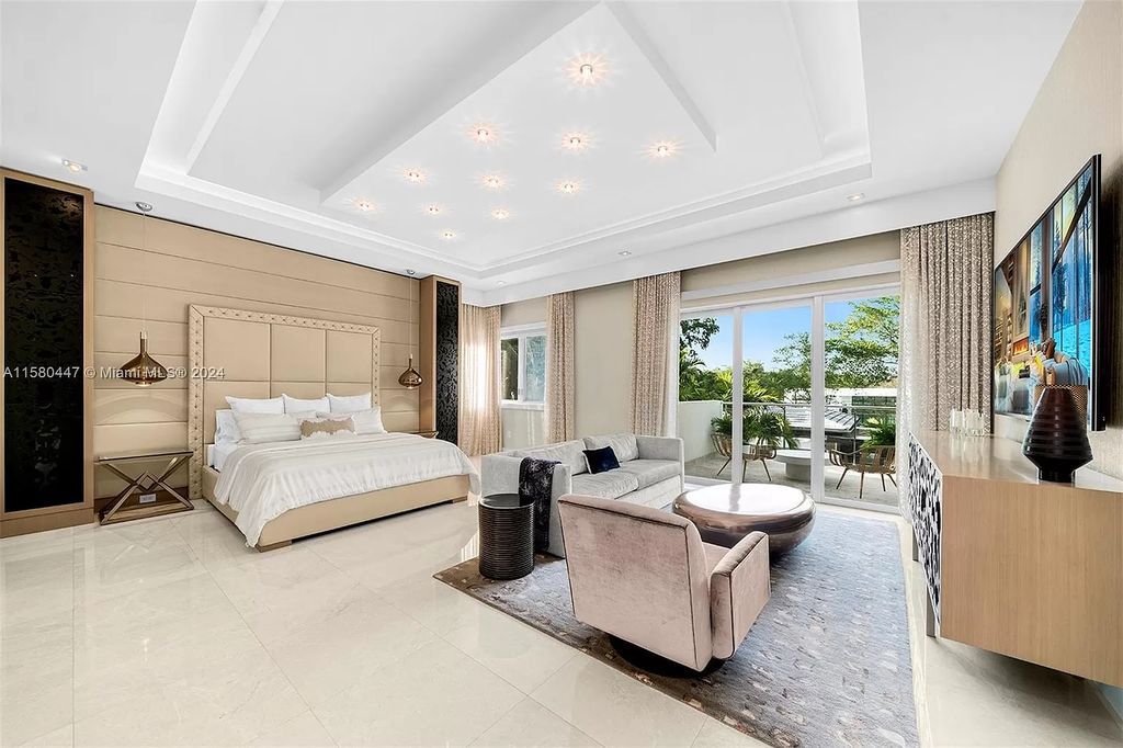 Enter a world of luxury in this exquisite 2-story gated sanctuary. Boasting a grand foyer, chef's kitchen, 4-suite bedrooms, elevator, home theater, and tropical backyard oasis with a guest house, this home offers unparalleled living.