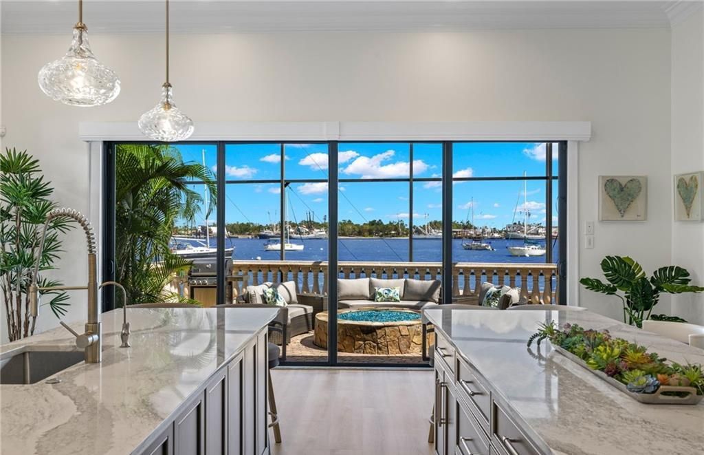 Boasting 180 feet of waterfront, a private dock, and an expansive pool area, this 4-bedroom haven offers endless opportunities for relaxation and adventure.