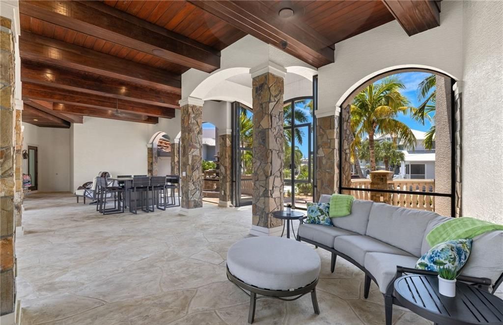 Boasting 180 feet of waterfront, a private dock, and an expansive pool area, this 4-bedroom haven offers endless opportunities for relaxation and adventure.