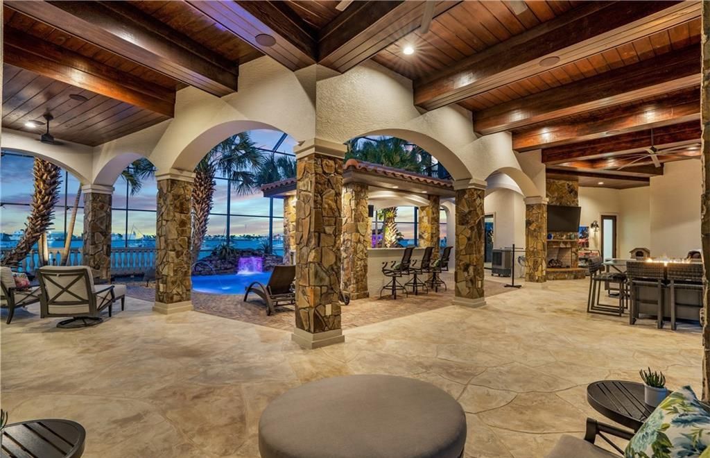 Boasting 180 feet of waterfront, a private dock, and an expansive pool area, this 4-bedroom haven offers endless opportunities for relaxation and adventure.