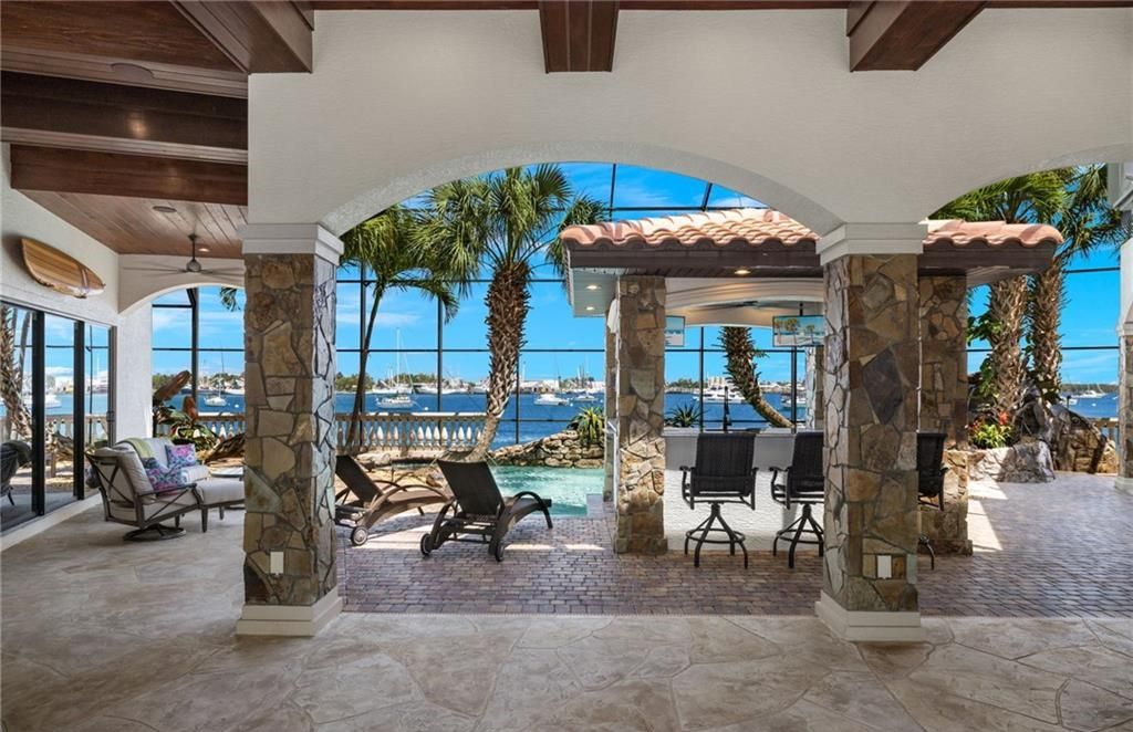 Boasting 180 feet of waterfront, a private dock, and an expansive pool area, this 4-bedroom haven offers endless opportunities for relaxation and adventure.