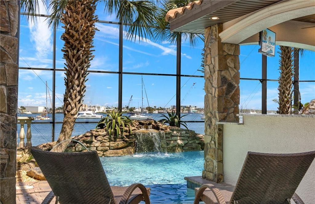 Boasting 180 feet of waterfront, a private dock, and an expansive pool area, this 4-bedroom haven offers endless opportunities for relaxation and adventure.