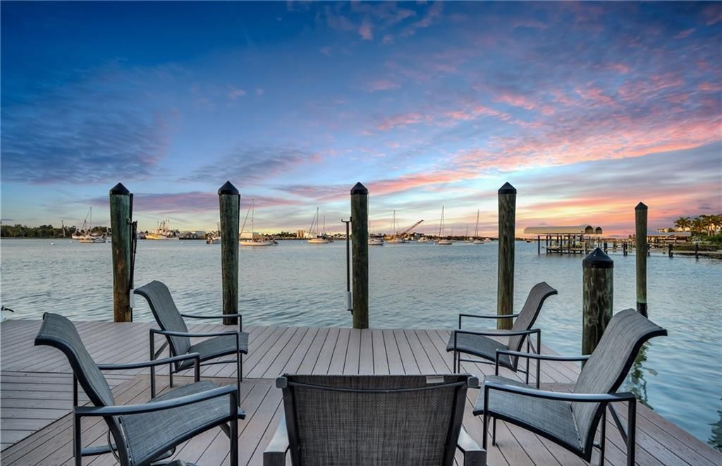 Boasting 180 feet of waterfront, a private dock, and an expansive pool area, this 4-bedroom haven offers endless opportunities for relaxation and adventure.