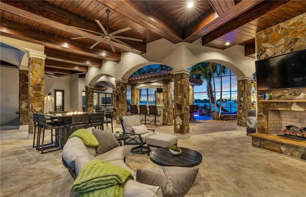 Boasting 180 feet of waterfront, a private dock, and an expansive pool area, this 4-bedroom haven offers endless opportunities for relaxation and adventure.