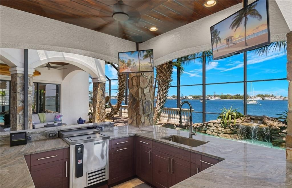 Boasting 180 feet of waterfront, a private dock, and an expansive pool area, this 4-bedroom haven offers endless opportunities for relaxation and adventure.