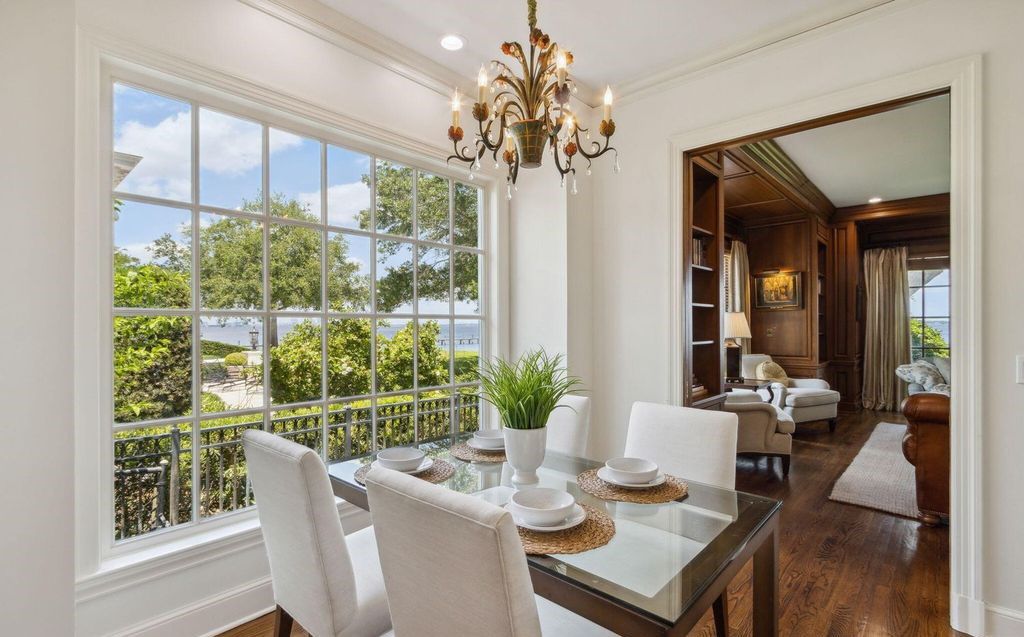 This 5-bedroom estate boasts breathtaking riverfront views, expansive grounds, and a floor plan designed for entertaining. Hardwood floors, fireplaces, and a gourmet kitchen create an unforgettable ambiance.