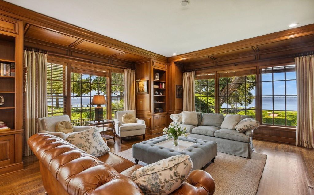 This 5-bedroom estate boasts breathtaking riverfront views, expansive grounds, and a floor plan designed for entertaining. Hardwood floors, fireplaces, and a gourmet kitchen create an unforgettable ambiance.